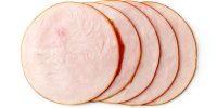 Sliced turkey ham isolated on white background, top view